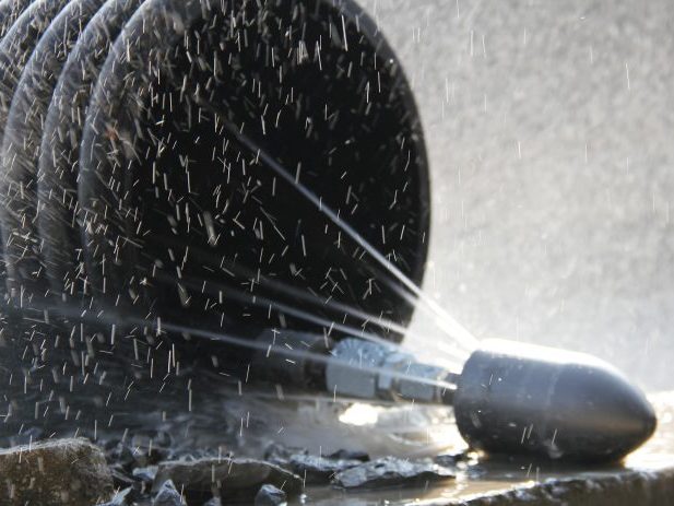 pipe cleaning using a specialized nozzle